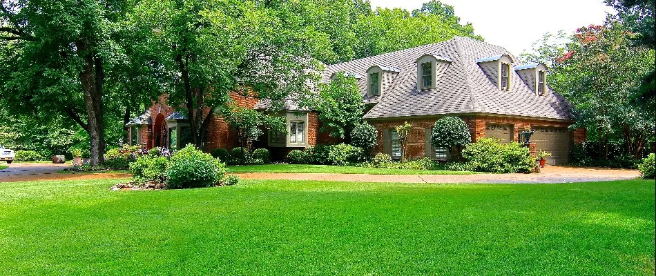 Residential property with a lush, green lawn.