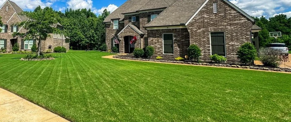 House in Memphis, TN, with newly mowed lawn.
