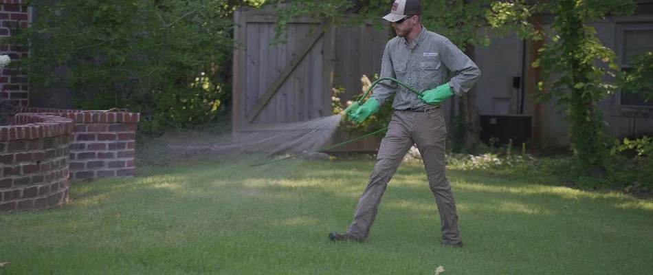 Lawn in Memphis, TN, being treated by a tech.