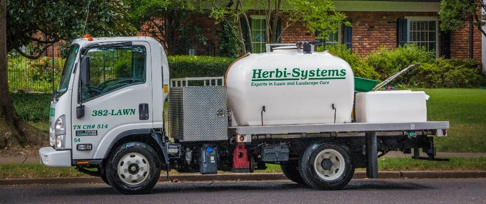 Lawn care company truck on a street in Memphis, TN.