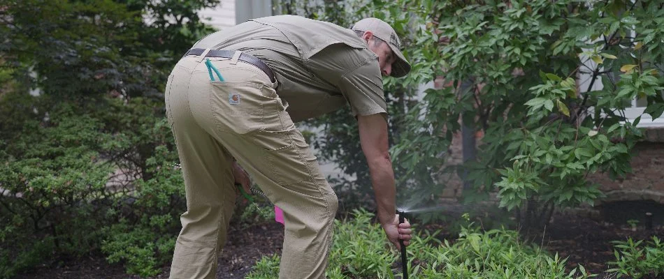 Technician inspecting an irrigation system in Memphis, TN.