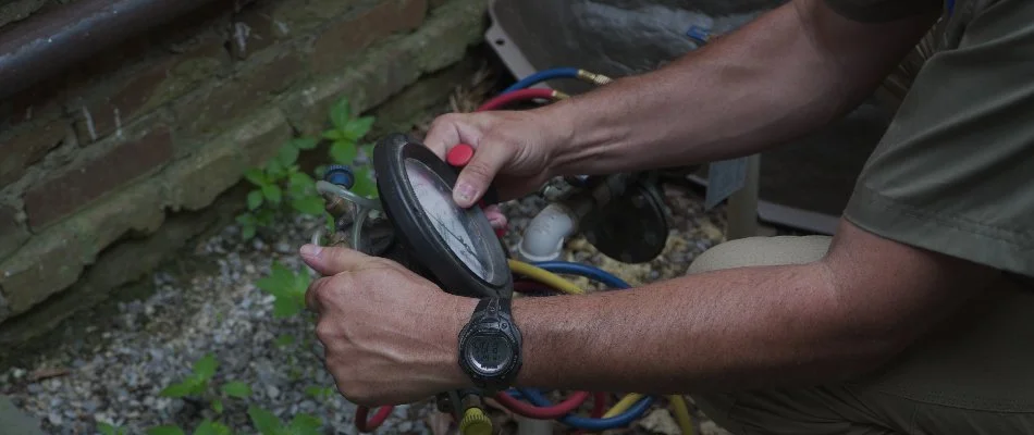 Worker blowing out an irrigation system in Memphis, TN.