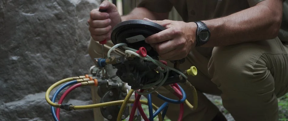Worker testing a backflow preventer in Memphis, TN.