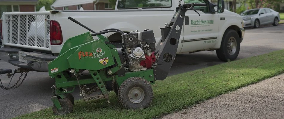 Core aerator machine on a lawn in Memphis, TN.