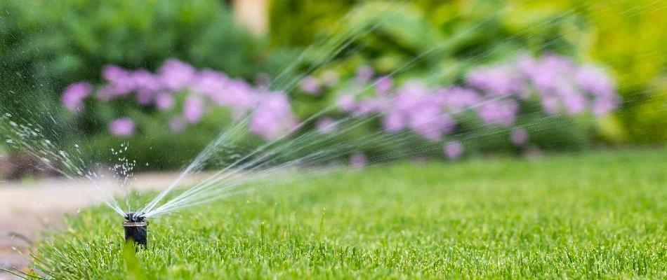 A sprinkler irrigation system watering a lawn in Rossville, TN.